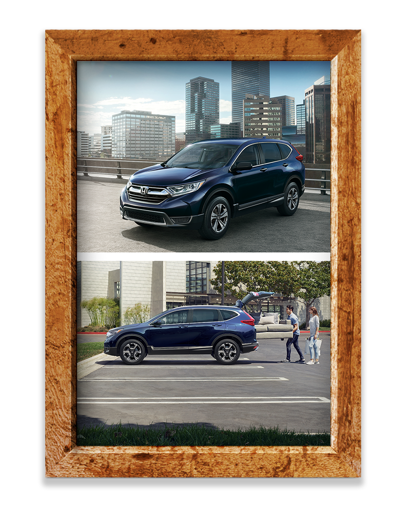Wooden picture frame, Honda CR-V with skyline behind, divider line, Honda CR-V in parking lot with people putting a couch in through rear door.